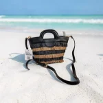 Bolso negro y beige para mujer con flecos y asa de mano