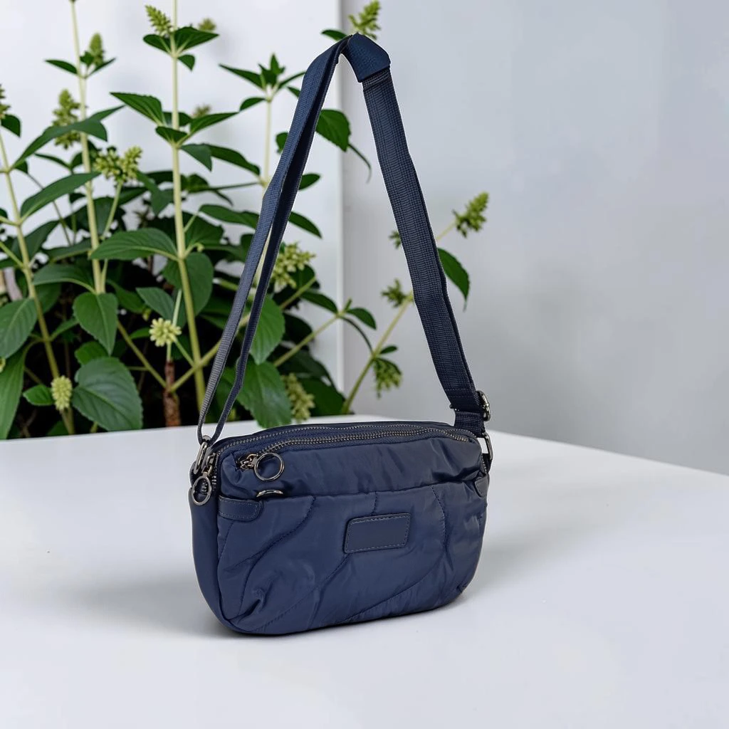 Bolso bandolera azul marino de nylon acolchado para mujer